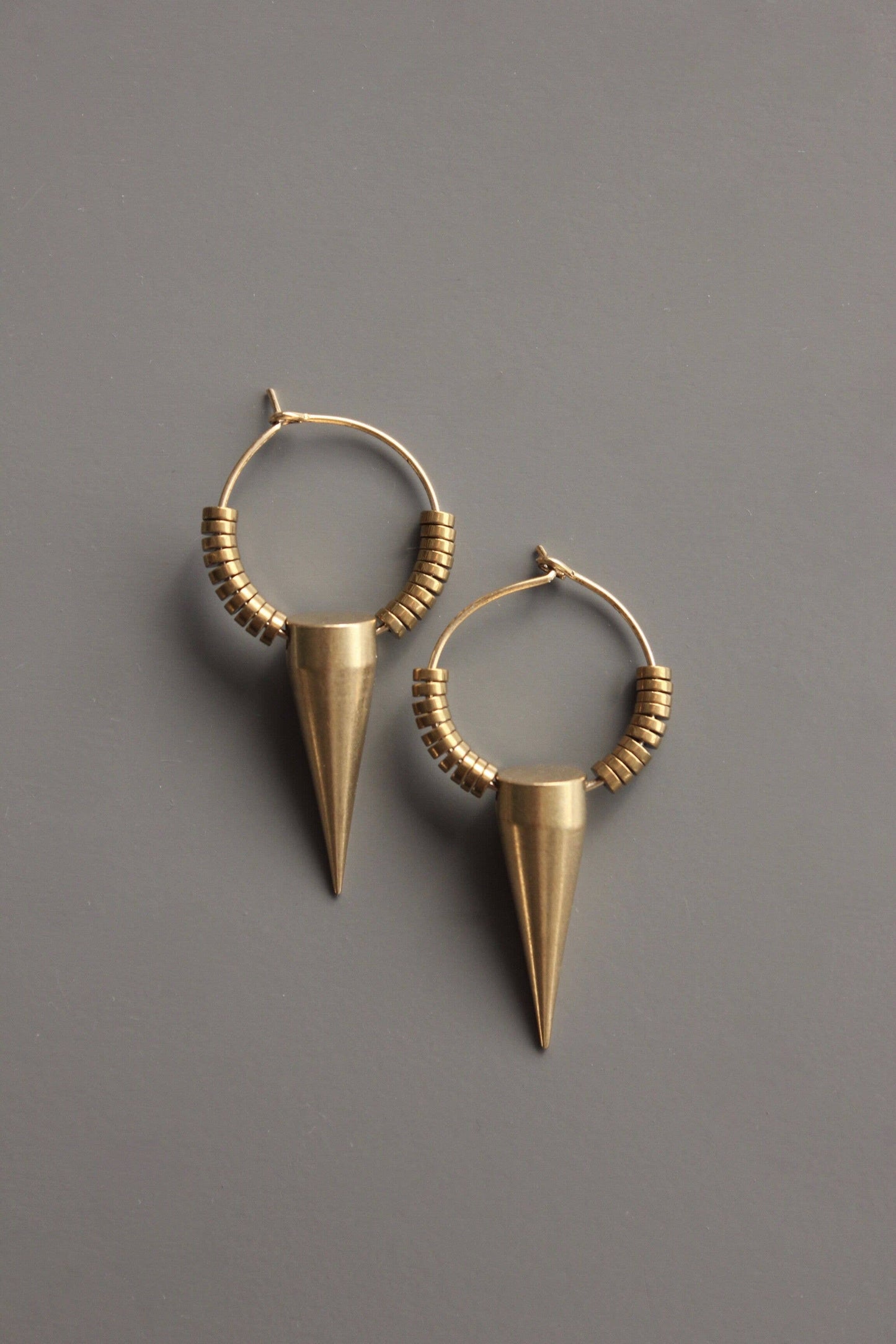 SAHE04 Gold plated hematite and brass spike hoop earrings