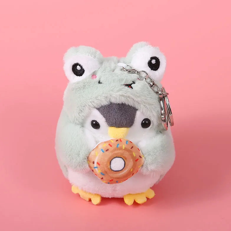 Penguin in Frog Costume Holding Donut Key Charm