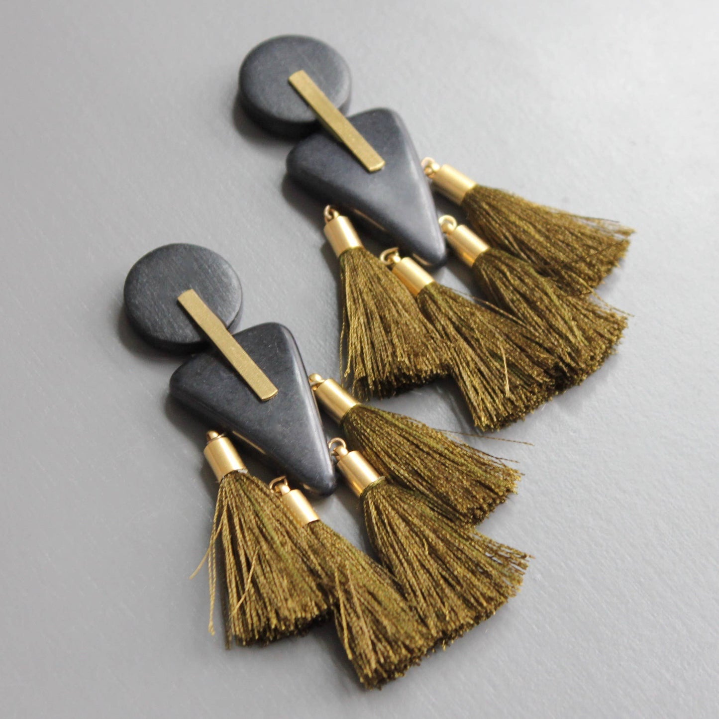 CHRE84 Black wood, brass, & dark mustard tassel earrings