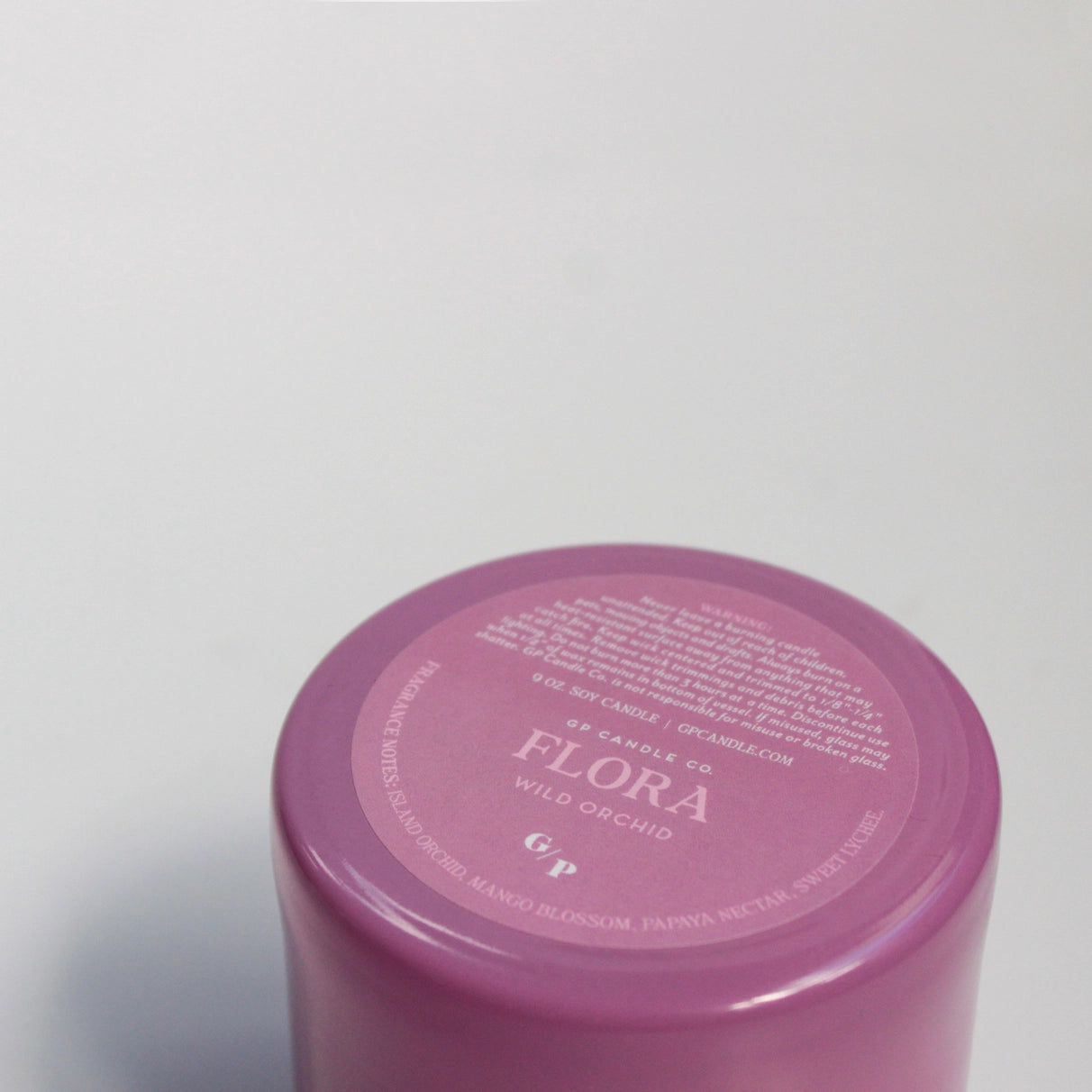 Flora 9 oz. Hue Candle (Wild Orchid)