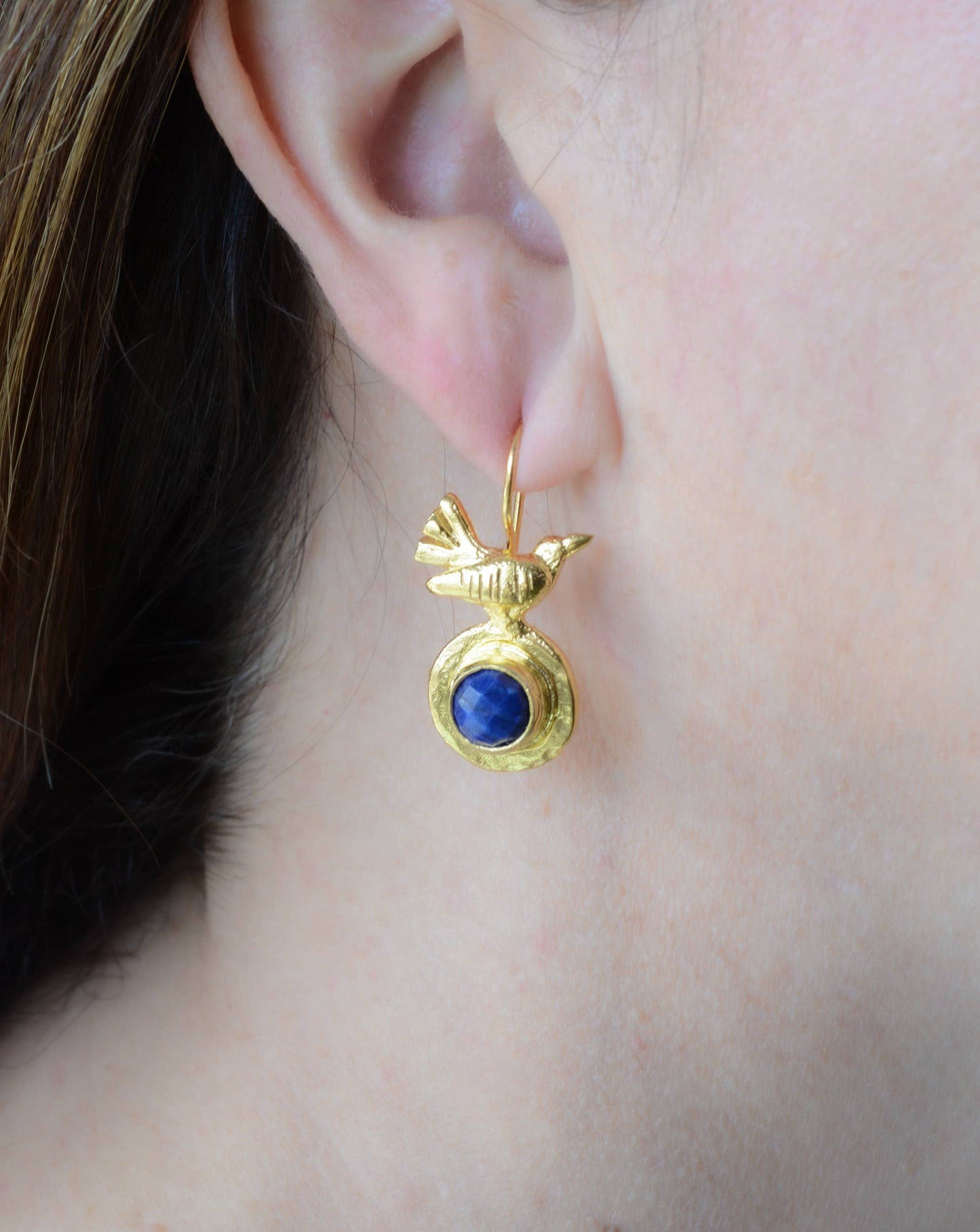 Gold plated bird earring with sapphire